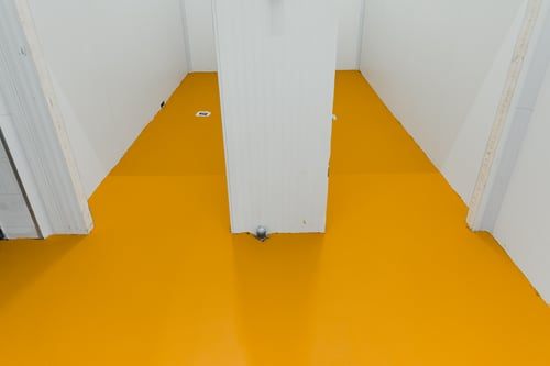 Residential garage floor finished with a smooth high-gloss epoxy coating